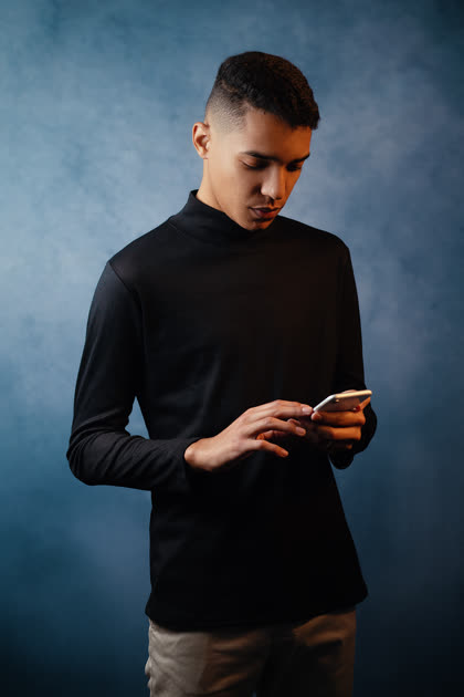Moisés reviewing footage on a phone